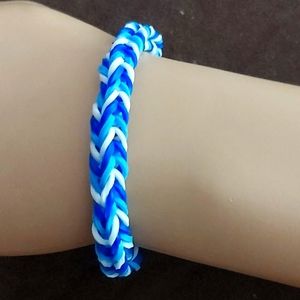 A blue white and light blue bracelet 💙